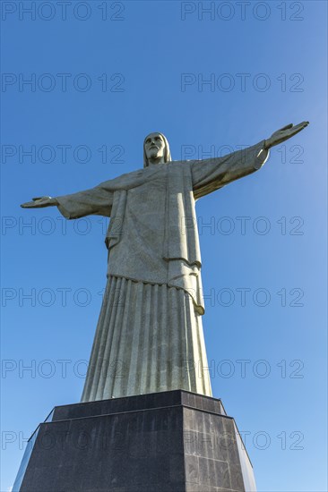 Christ the Redeemer statue in Rio de Janeiro, Brazil with blue sky in the background