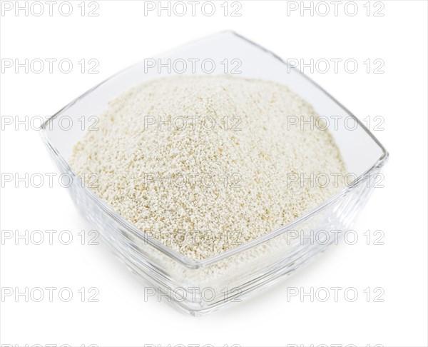 Bread Crumbs isolated on white background (selective focus, close-up shot)