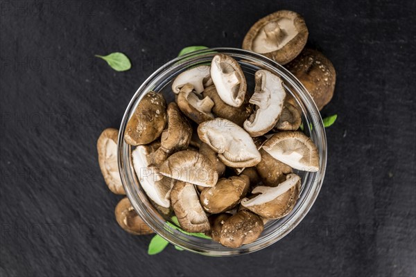 Portion of fresh Shiitake mushrooms close-up shot, selective focus
