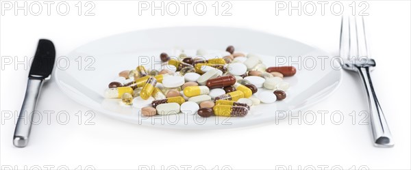 Drugs prepared as meal (close-up shot, selective focus) isolated on white background
