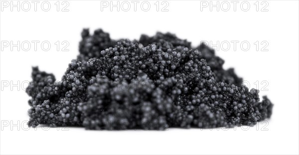 Portion of Black Caviar isolated on white background (selective focus)
