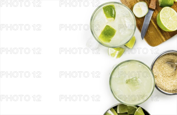 Caipirinha isolated on white background (selective focus, close-up shot)