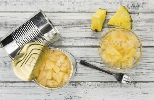 Preserved Pineapple pieces on a vintage background as detailed close-up shot, selective focus