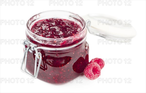 Fresh made Raspberry Jam isolated on white background, close-up shot