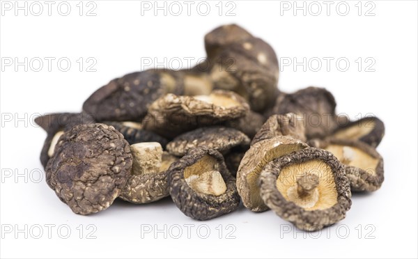 Dried Shiitake mushrooms isolated on white background, selective focus, close-up shot