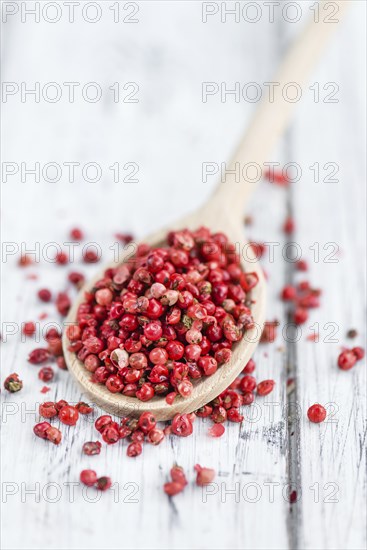 Portion of fresh Pink Peppercorns close-up shot, selective focus