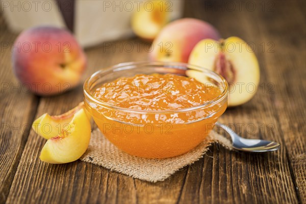 Peach Jam on a vintage background as detailed close-up shot, selective focus