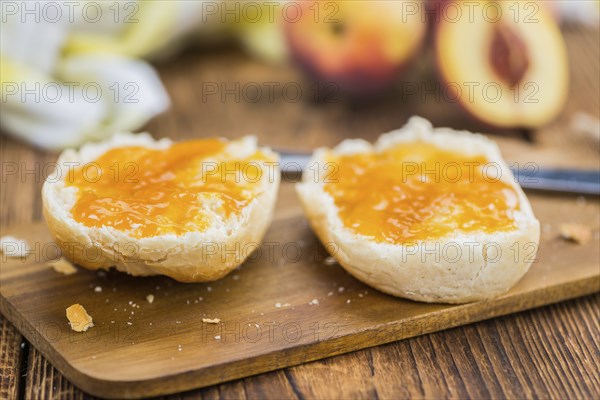 Portion of fresh Peach Jam close-up shot, selective focus
