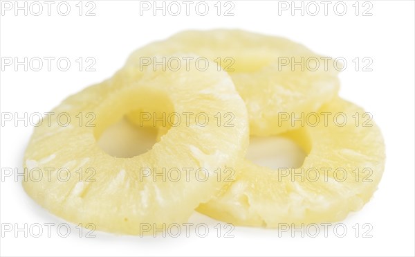 Portion of Preserved Pineapple Rings as detailed close-up shot isolated on white background