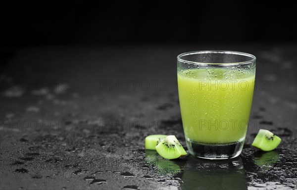 Fresh made Kiwi Smoothie (selective focus) on a vintage looking background