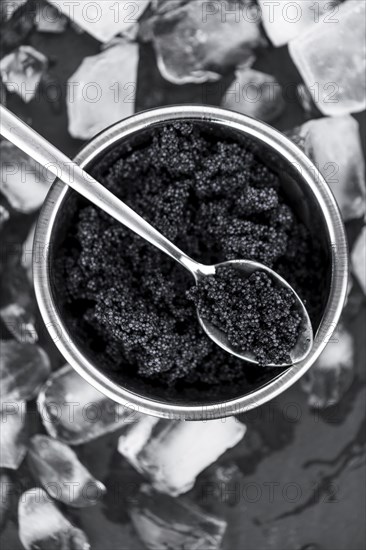 Caviar on a vintage looking slate slab (selective focus)
