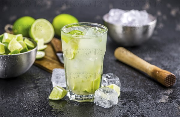 Slate slab with Caipirinha (selective focus, close-up shot)