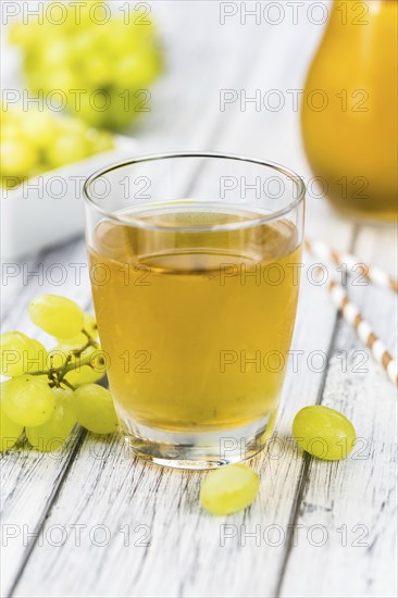 Some healthy Grape Juice (selective focus, close-up shot)