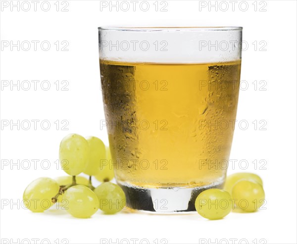 Grape Juice isolated on white background (selective focus, close-up shot)