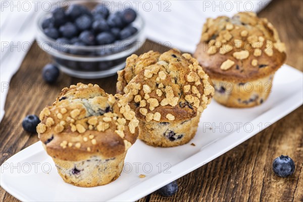 Fresh Blueberry Muffins as detailed close-up shot (selective focus)