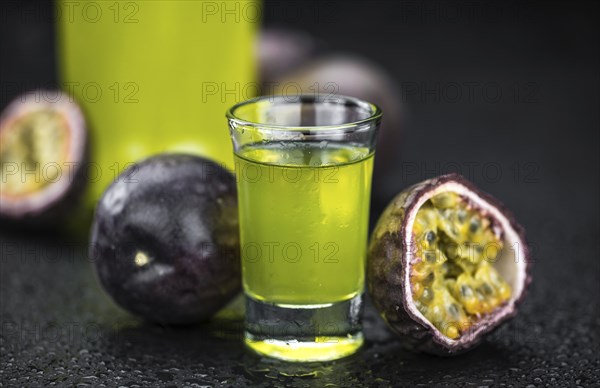 Passion Fruit Liqueur (fresh made) as detailed close-up shot, selective focus