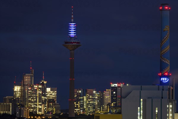 The top of the Europe Tower in Frankfurt am Main shines in the blue of the European Union (EU)