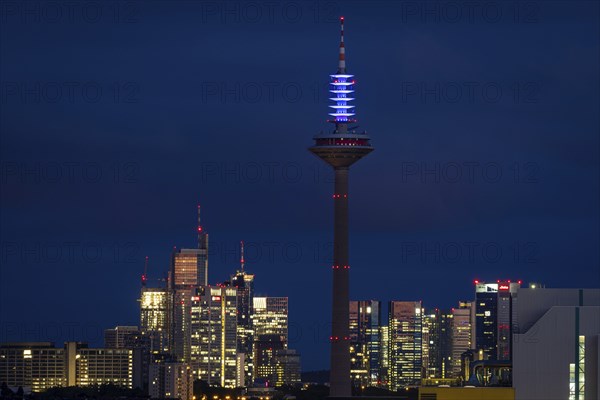 The top of the Europe Tower in Frankfurt am Main shines in the blue of the European Union (EU)