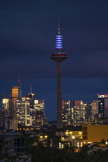 The top of the Europe Tower in Frankfurt am Main shines in the blue of the European Union (EU)