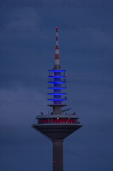 The top of the Europe Tower in Frankfurt am Main shines in the blue of the European Union (EU)