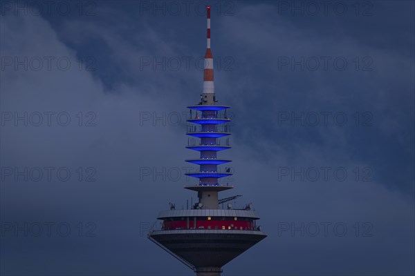 The top of the Europe Tower in Frankfurt am Main shines in the blue of the European Union (EU)