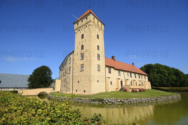 Tosterup castle against blue sky in Tomelilla Municipality, Skane County, Sweden, Scandinavia,
