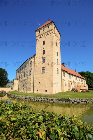 Tosterup castle against blu sky in Tomelilla Municipality, Skane County, Sweden, Scandinavia,