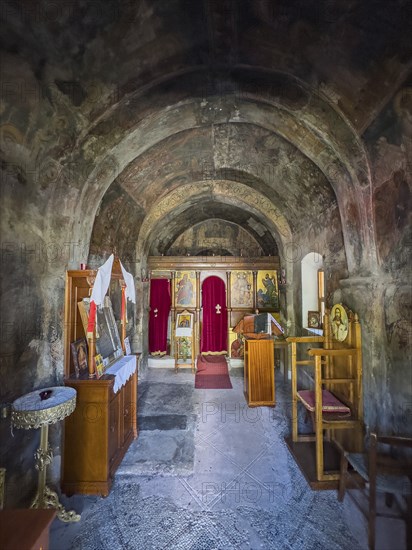 Interior with antique frescoes in the historic small single-nave church Panagia Throniotissa Naos