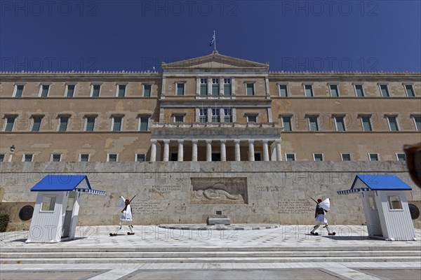 Parliament building with Evzones in traditional dress, blue sky, Athens, Greece, Europe