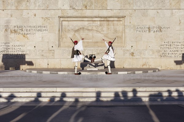 Two Evzones in traditional dress in front of the parliament building, Tomb of the Unknown Soldier,