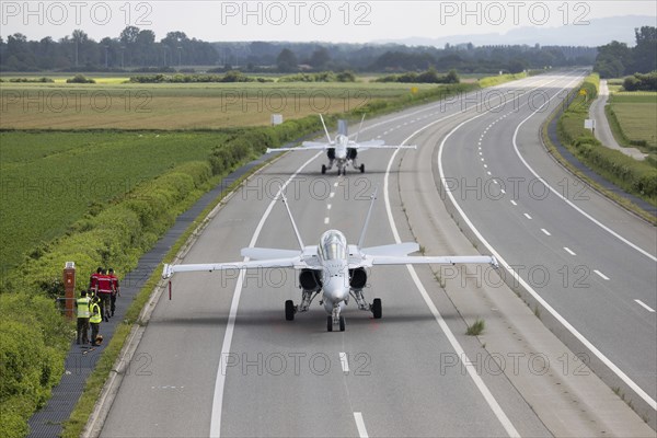 Swiss Air Force F/A 18 fighter aircraft take off and land on the A1 motorway during the Alpha Uno