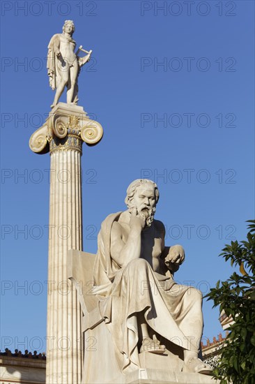 Sculpture of the Greek philosopher Socrates in front of the Academy of Athens, blue sky, sculptor