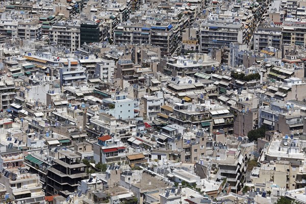 View of densely built-up metropolis, sea of houses without greenery, symbolic image concrete