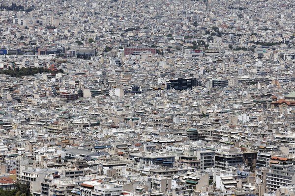 View of densely built-up metropolis, sea of houses without greenery, symbolic image concrete