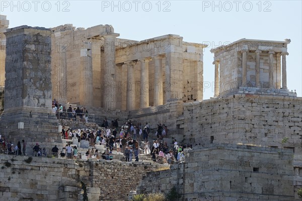 Propylaea and Temple of Athena Nike, tourists climbing the Grand Staircase, Acropolis, Athens,