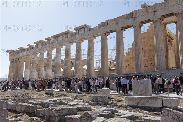 Parthenon north facade, in front of it many tourists, temple with Doric columns, Acropolis, Athens,