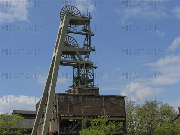 Old winding tower of an industrial building under a blue sky, HErten, North Rhine-Westphalia,