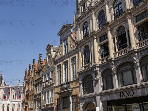 Row of historic buildings with detailed facades and windows in the city centre in clear summer
