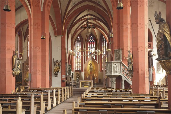 Interior view with figures and pulpit of late Romanesque St Andrew's Church, Karlstadt, Bavaria,