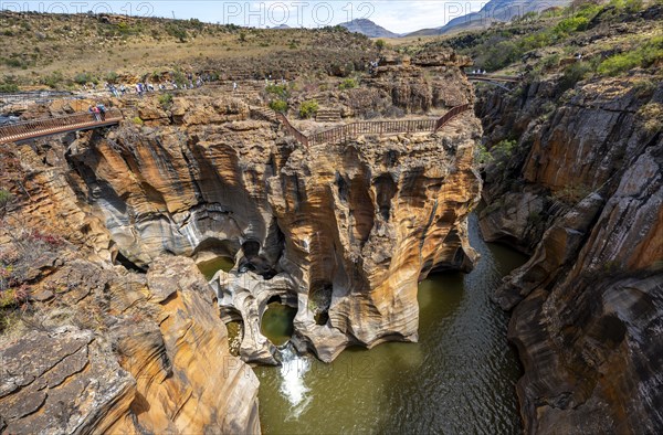 Bridges over a canyon with steep orange-coloured cliffs and the Blyde River, Bourke's Luck