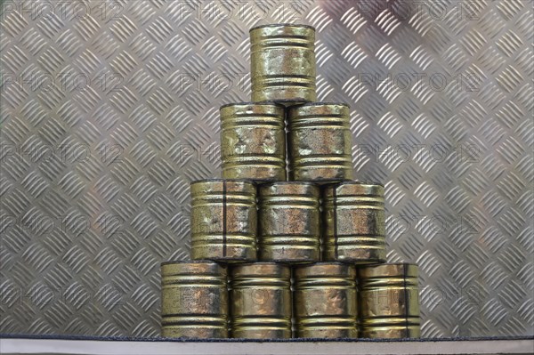 Stacked tin cans for a throwing game at a carnival funfair or Christmas market, copy space,