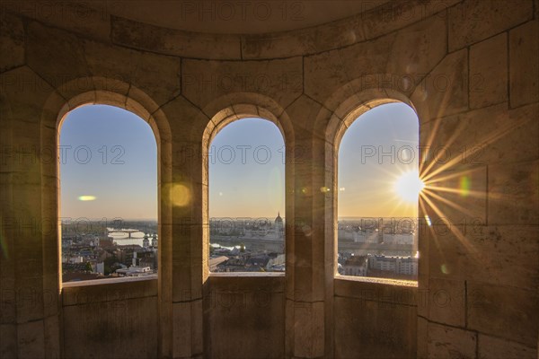 Old historic fortress and church at sunrise. City panorama at dusk. View of the Danube Fishermen's