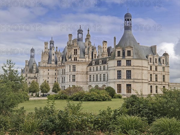 Chateau de Chambord a majestic medieval castle with green gardens. Beautiful palace in the region