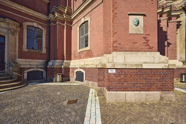 Facade with memorial plaque to Ernst Georg Sonnin, the builder of the main church of St Michaelis,