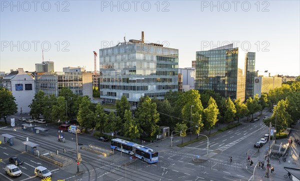 View from above of the crossroads at Stiglmaierplatz with public bus, modern office buildings in