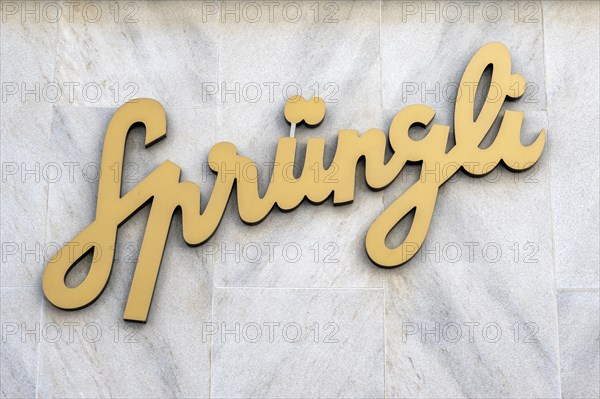 Company logo, advertising sign of the chocolate manufacturer Confiserie Sprüngli AG on a house