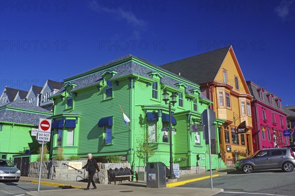 Colourful historic buildings on a city street under a clear blue sky, Lunenburg, Nova Scotia,