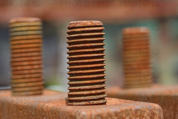 Grunge background of rusted metal bolt