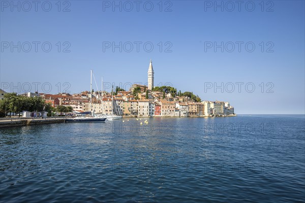 Old historic dreamy town on a beautiful island. Panorama of a romantic tourist town on a coast.