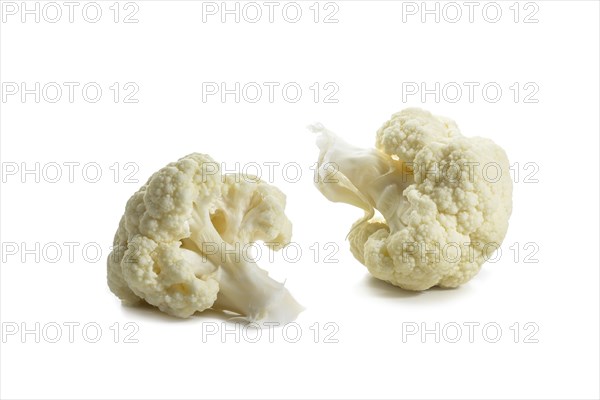 Two pieces or florets of cauliflower, ingredient for healthy cooking with vegetables, isolated on a